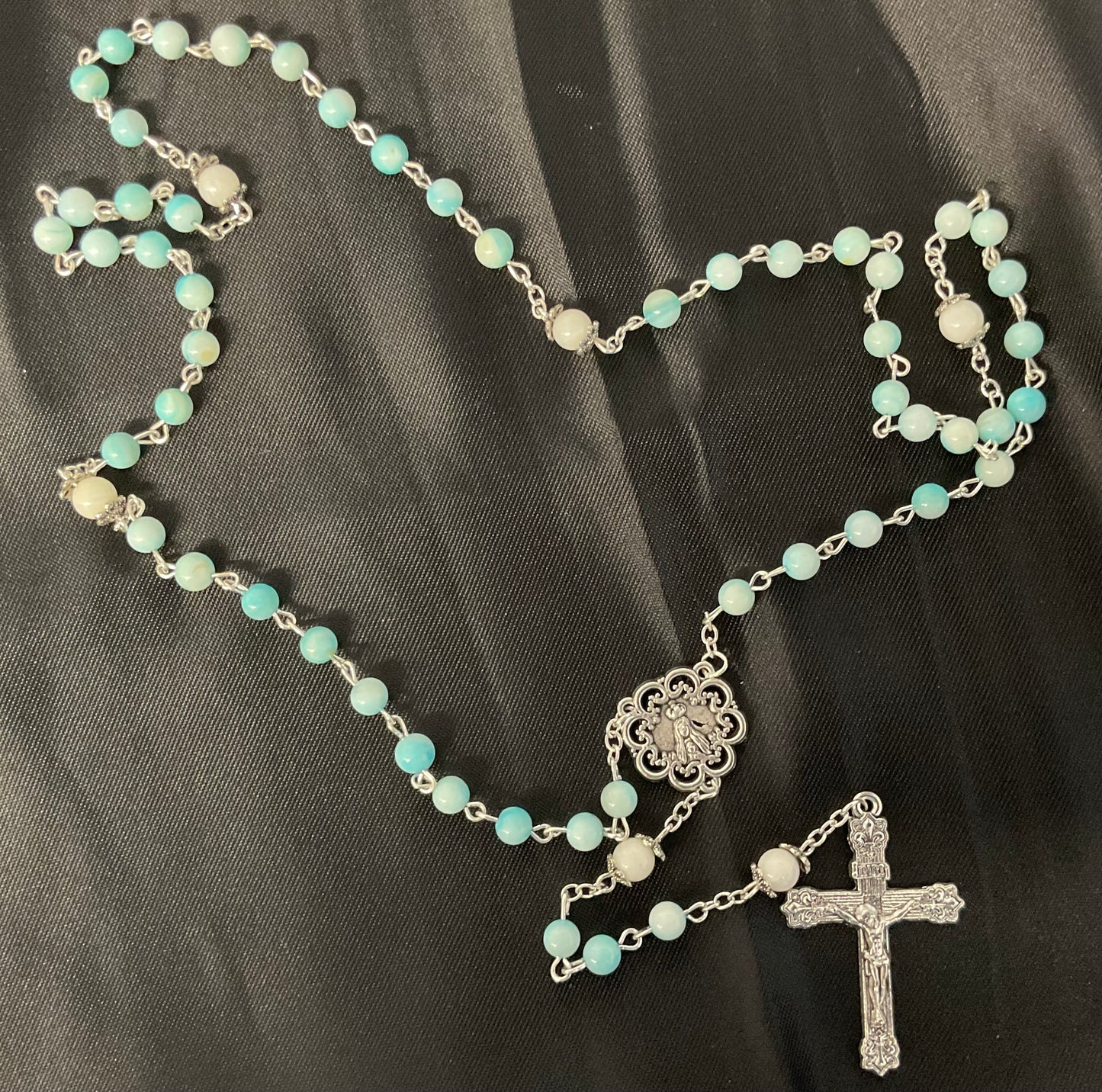 Lite Blue Rosary with White Our Father Beads